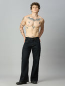 Model wearing The Lofa men's deep blue bootcut denim jeans styled for a modern casual look