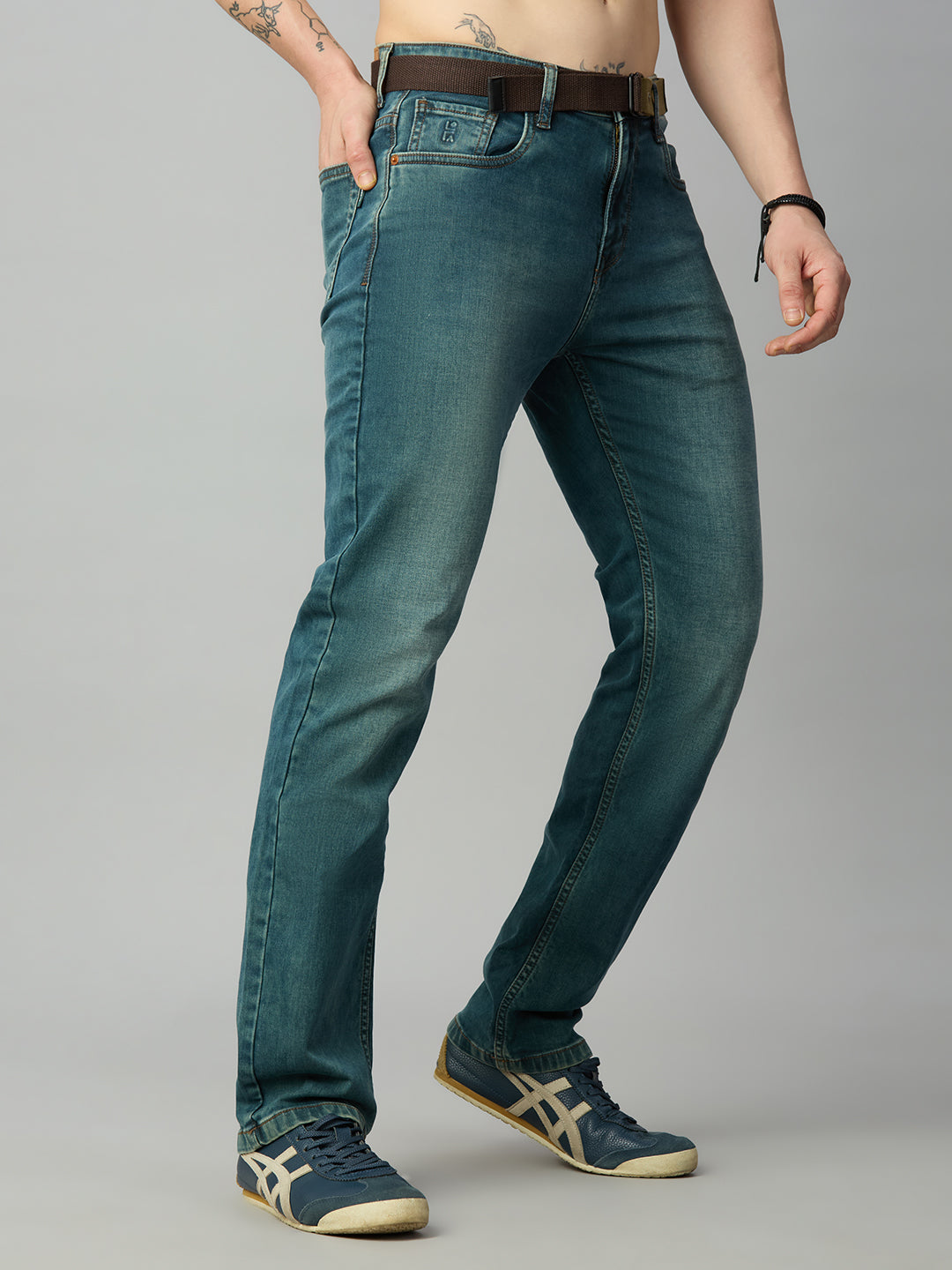 Men's straight fit stretch denim jeans in a light blue-green vintage wash with attached belt – right side view