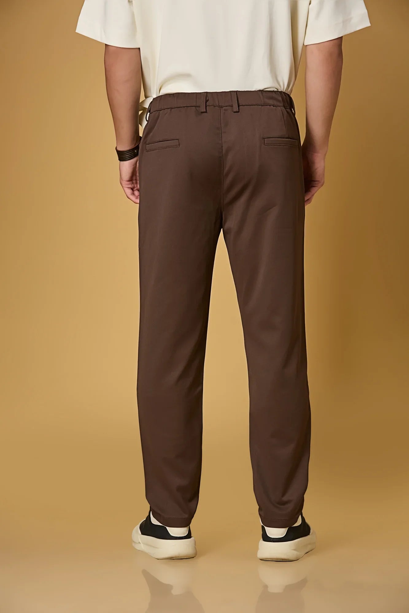 Men’s coffee brown casual trousers back view – smooth polyester comfort fabric.