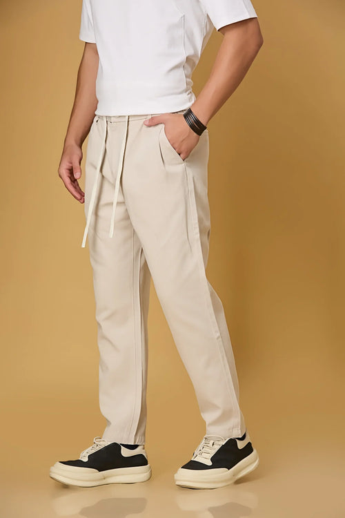 Beige trousers side view showing comfort fit and adjustable waist.