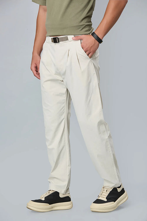 Beige stretchable trousers side view showing comfort fit and pleated front.