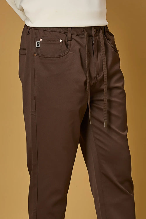 Close-up of Coffee Brown polyester fabric texture showing smooth and stretchable finish.