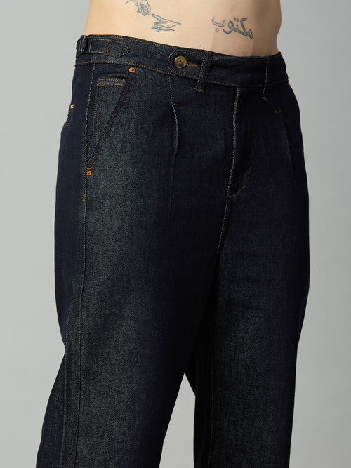 Close-up of extended waistband and side waist adjusters on men's deep blue denim jeans