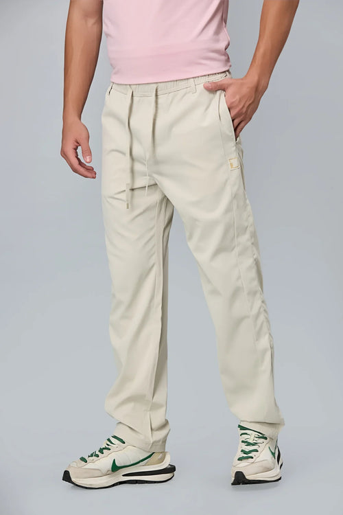 Side View of LOFA Cream Comfort Fit Polyester Trousers with Waist Strings