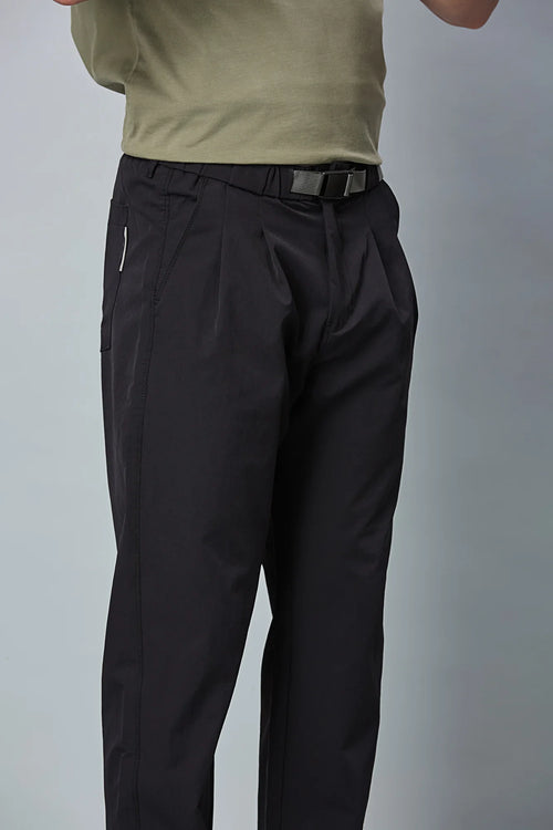 Close-up of Navy Blue trousers belt, elastic waist, and pleated design details