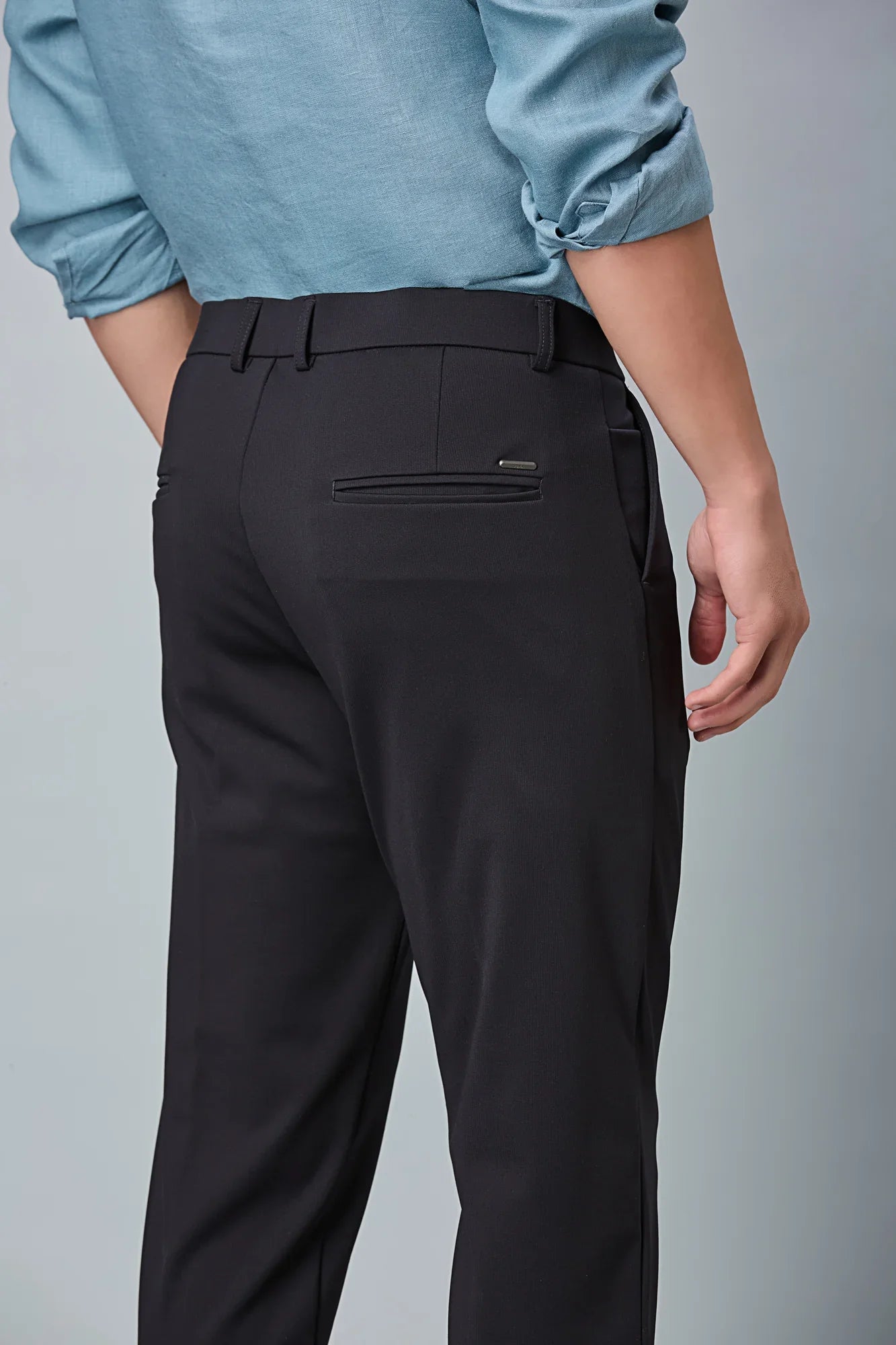 Close-up of nylon–cotton–spandex fabric and fine stitching detail of LOFA stretchable formal trousers.