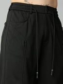 Close-up of the uniquely designed front utility pocket with premium stitching and textured Tencel stretch fabric.