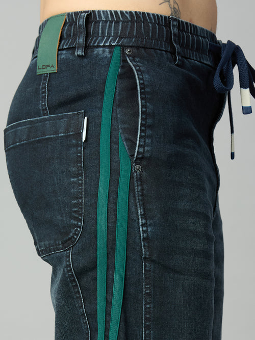 Close-up of elastic waistband and adjustable drawstring on men's baggy stretch denim jeans