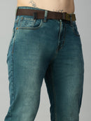 Close-up of attached adjustable web belt, waistband, and button closure on men's straight fit denim jeans