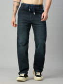 Men's baggy stretch denim jeans with green side stripes and elastic drawstring waist – front view