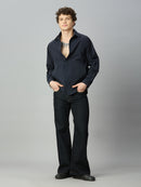 Model wearing The Lofa men's deep blue bootcut denim jeans styled for a modern casual look