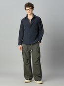 Model wearing relaxed fit cargo pants with casual streetwear styling
