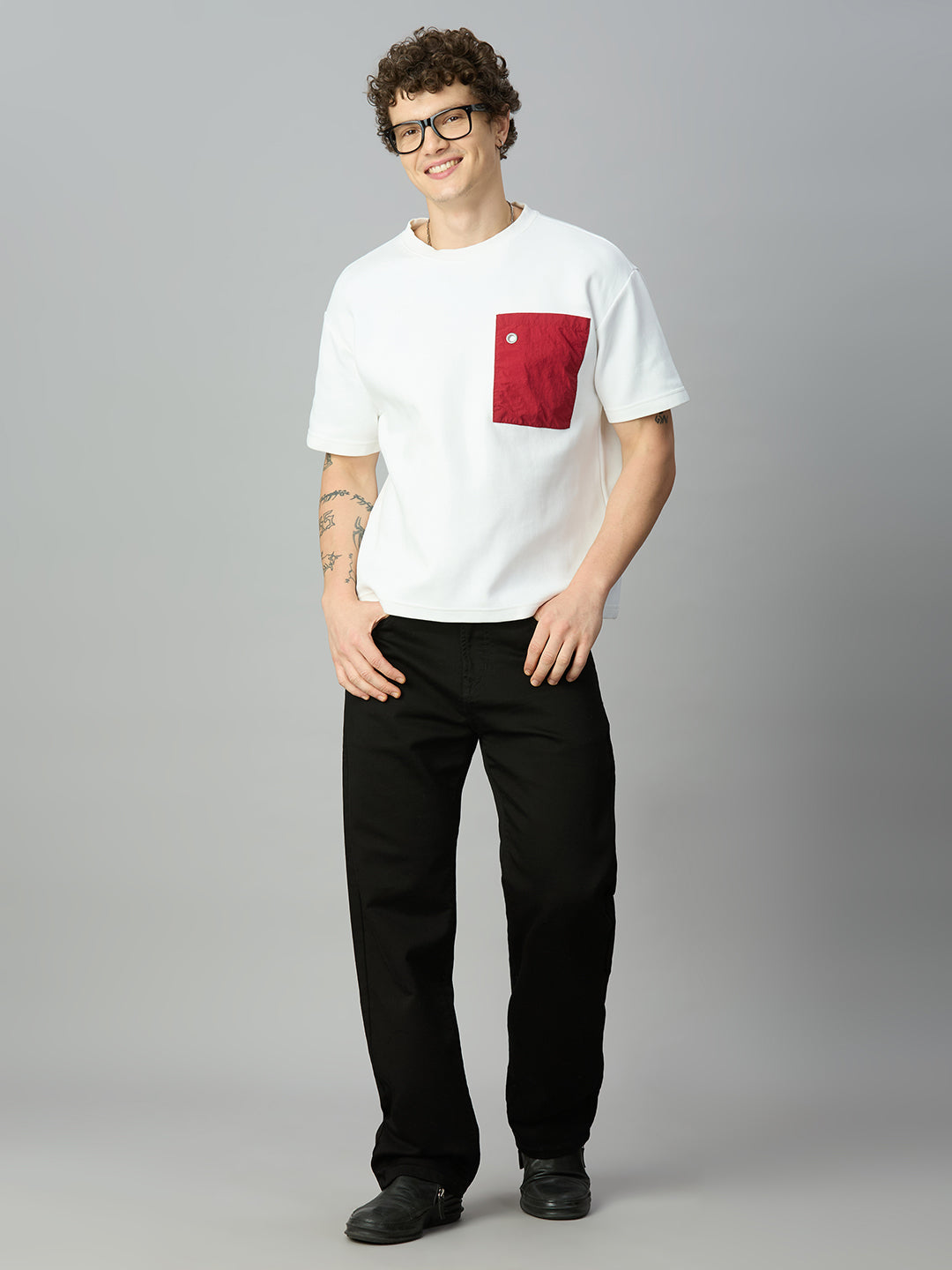 Model wearing The Lofa men's black baggy fit stretch denim jeans styled for a modern streetwear look