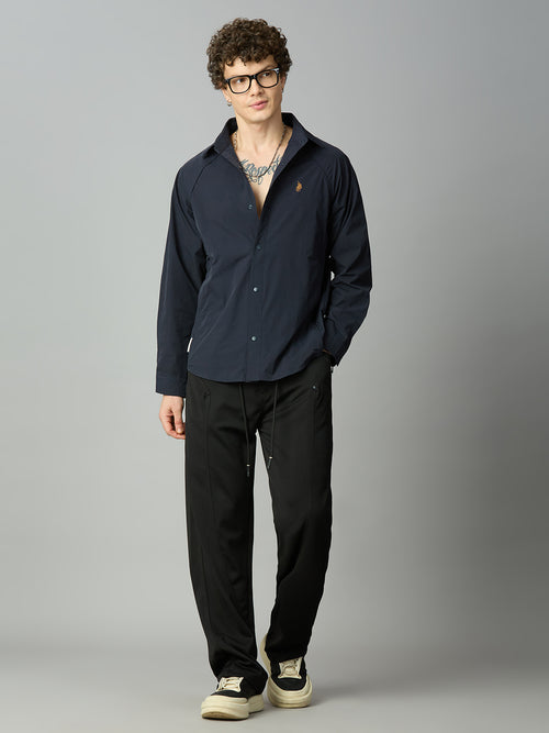 Model wearing Lofa™ Relaxed Fit Tencel Stretch Drawstring Pants styled with a casual oversized top and sneakers for a contemporary everyday look.