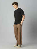 Model wearing Lofa™ baggy smart pants with side stripes styled for modern streetwear and casual everyday wear