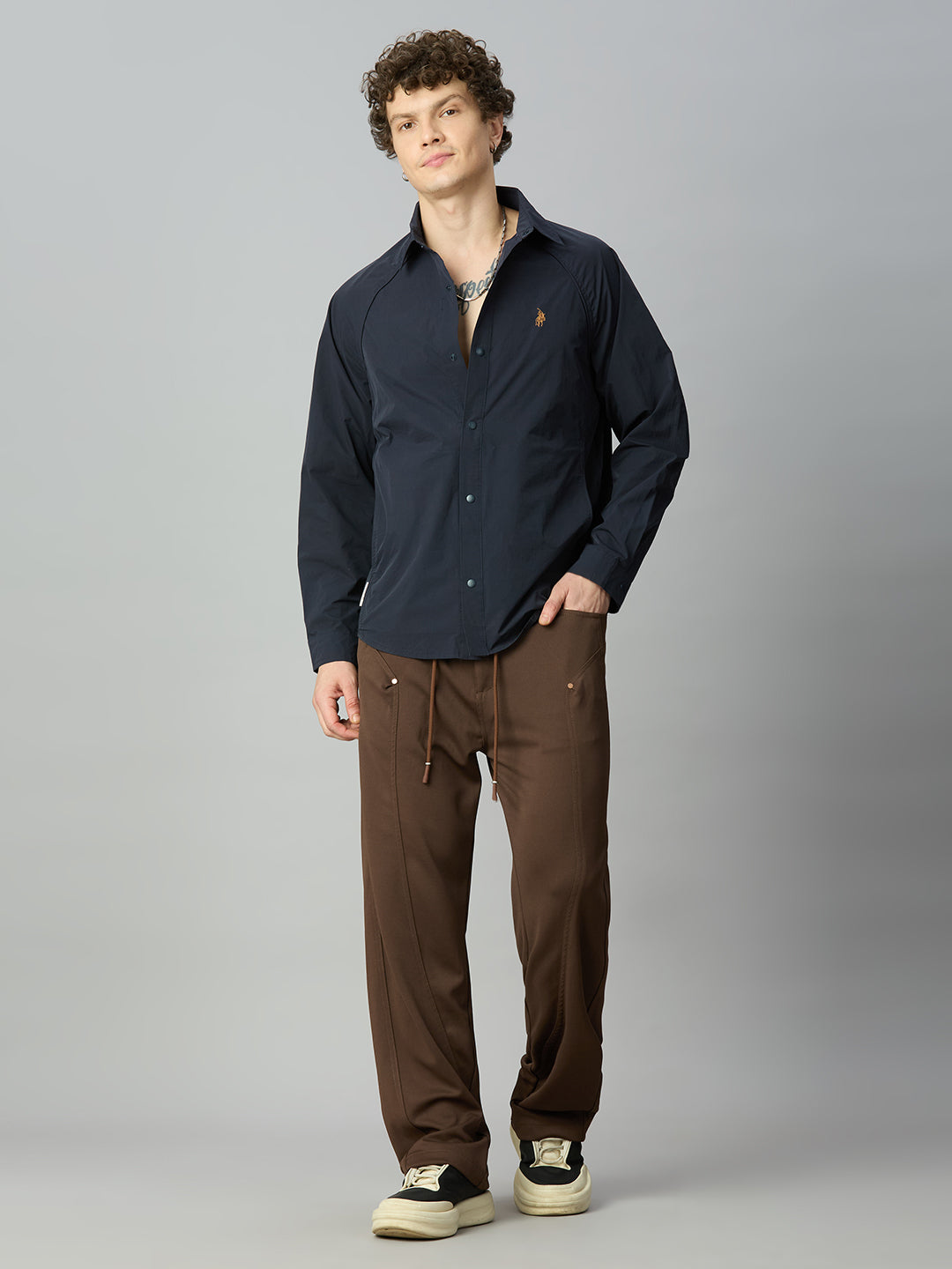 Model wearing Lofa™ Relaxed Fit Tencel Stretch Drawstring Pants styled with a casual oversized top and sneakers for a contemporary everyday look.