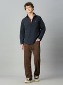Model wearing Lofa™ Relaxed Fit Tencel Stretch Drawstring Pants styled with a casual oversized top and sneakers for a contemporary everyday look.
