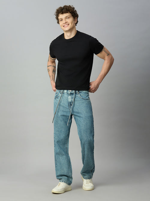 Model wearing The Lofa men's light blue washed baggy denim jeans with elastic waistband and drawstring for a relaxed streetwear look