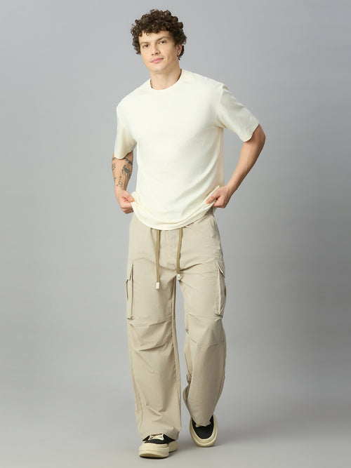 Model wearing relaxed fit cargo pants with casual streetwear styling