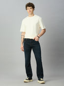 Model wearing The Lofa men's dark wash straight fit stretch denim jeans styled for a smart casual everyday look