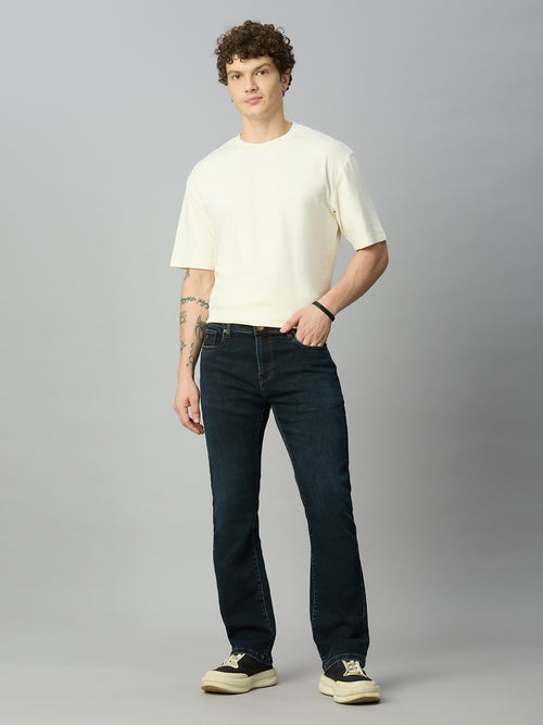 Model wearing The Lofa men's dark wash straight fit stretch denim jeans styled for a smart casual everyday look