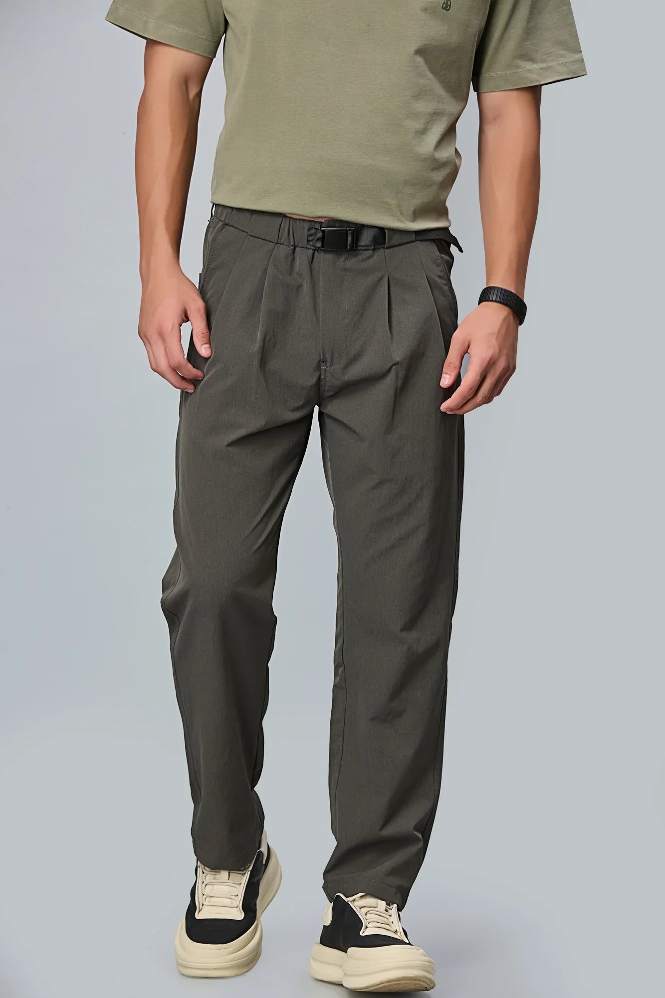 Men’s grey polyester trousers front view – comfort fit with double pleats and belt.