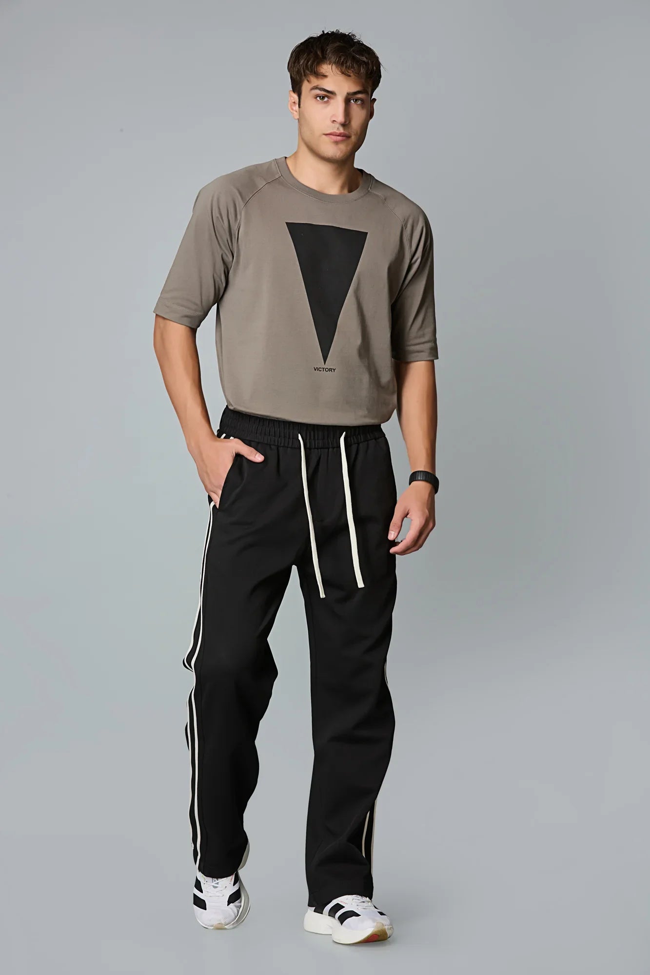 Side View of LOFA Men’s Black Baggy Fit Active Pants with Waist Strings