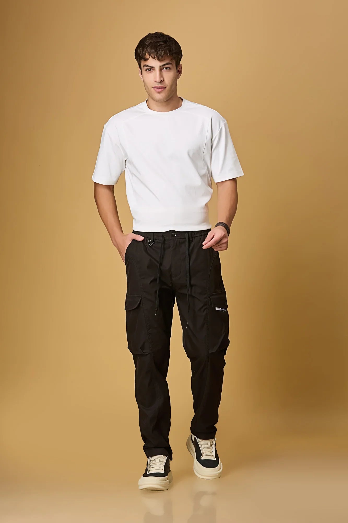 LOFA black cargo pants styled for men – casual and versatile everyday look.