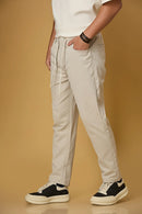 Beige stretchable trousers side view showing casual comfort fit.