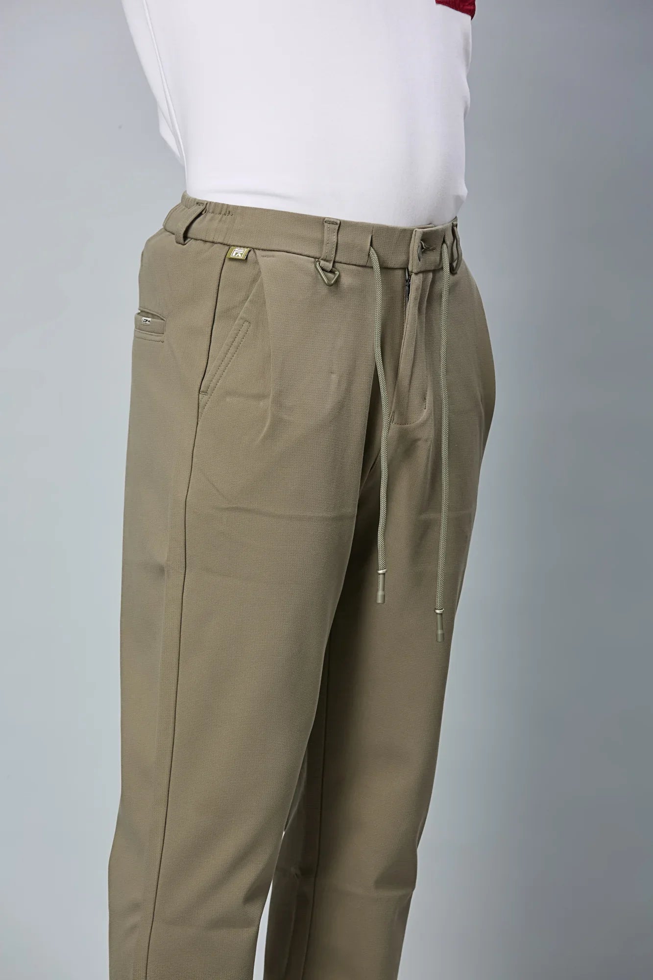 Triangle Ring and Waist String Detail on LOFA Men’s Mehendi Green Relaxed Fit Trousers