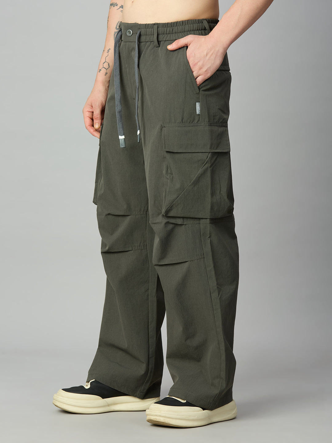 Men's relaxed fit cargo pants left side view showing utility pockets