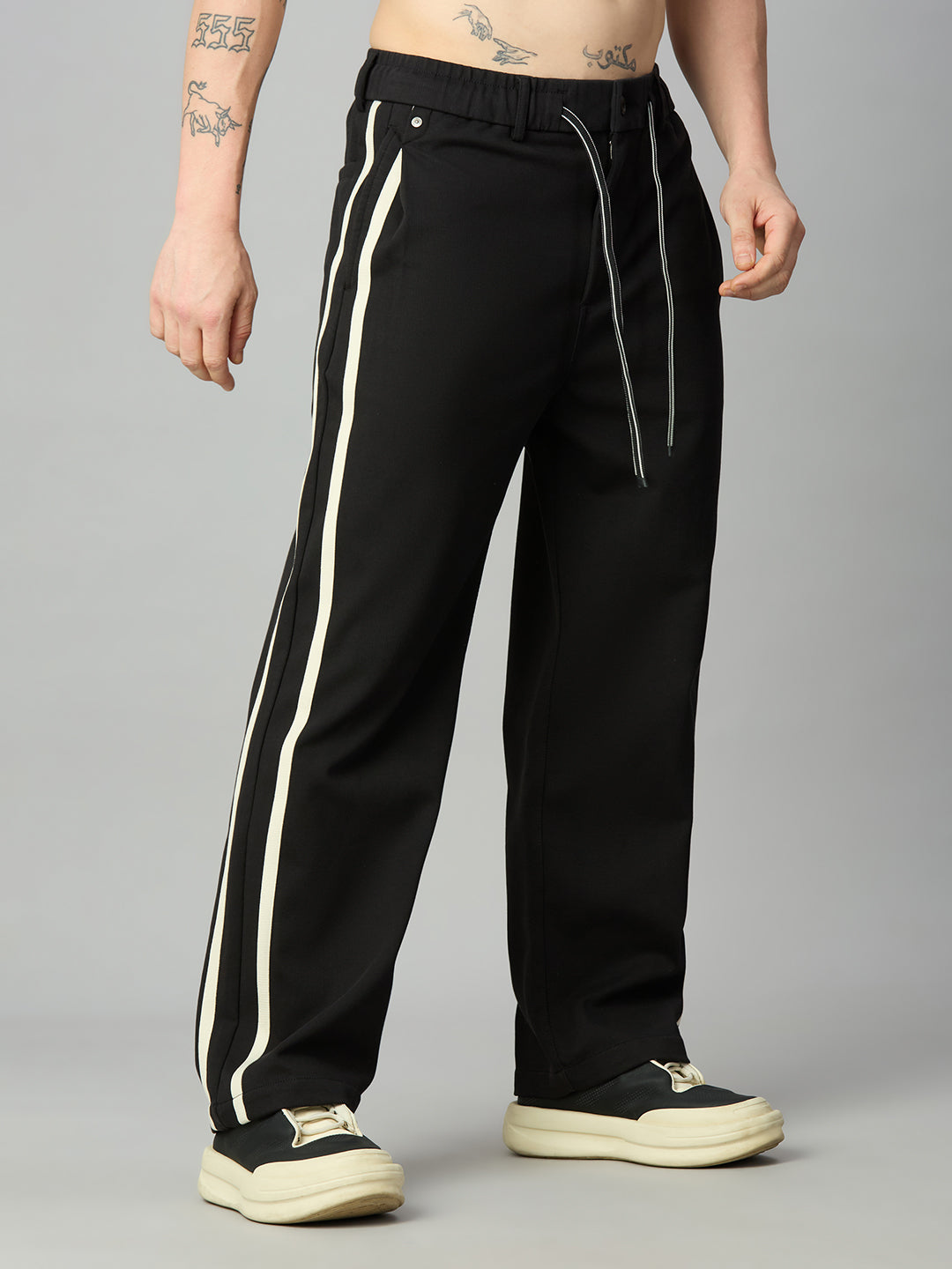 Men's relaxed fit cotton-Tencel smart pants with contrast side stripes – left side profile