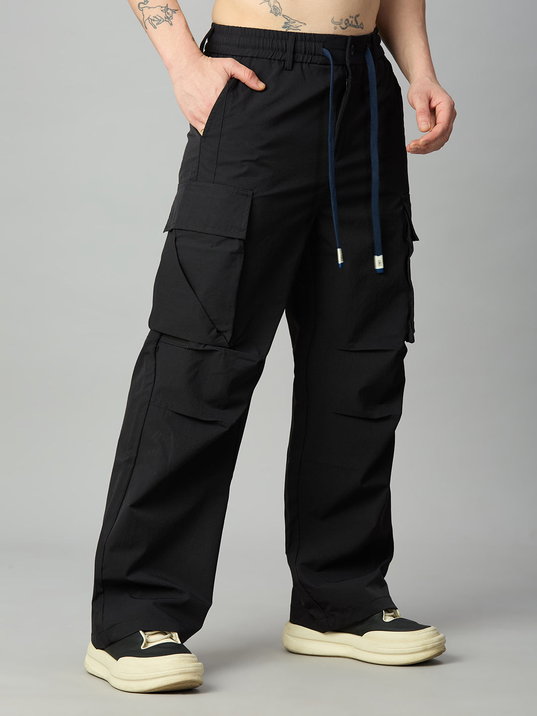 Men's relaxed fit cargo pants left side view showing utility pockets