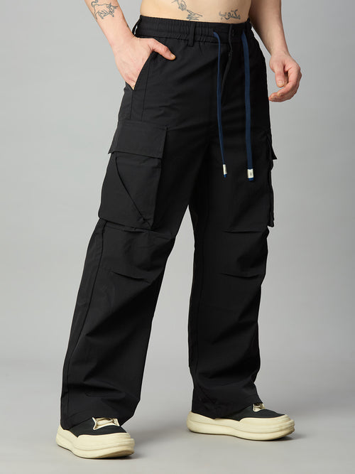 Men's relaxed fit cargo pants left side view showing utility pockets