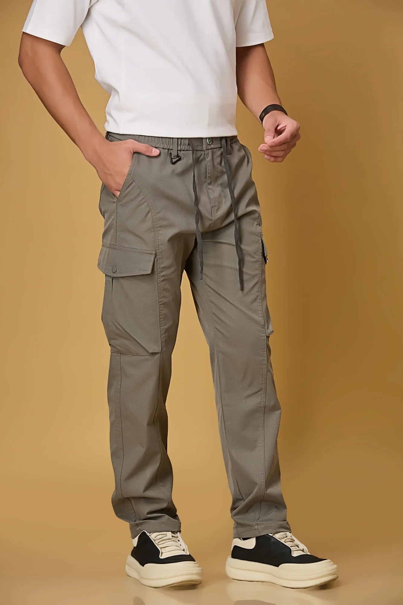 grey pants side view showing double cargo pockets and relaxed fit.