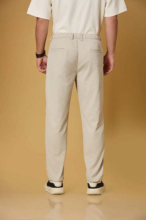 Men’s beige casual trousers back view – smooth polyester comfort fabric.