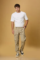 Men wearing LOFA Khaki cargo pants in a casual outdoor setting.