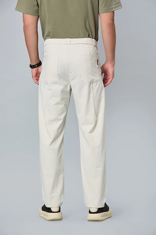 Men’s beige formal trousers back view – 100% polyester with elastic waist.