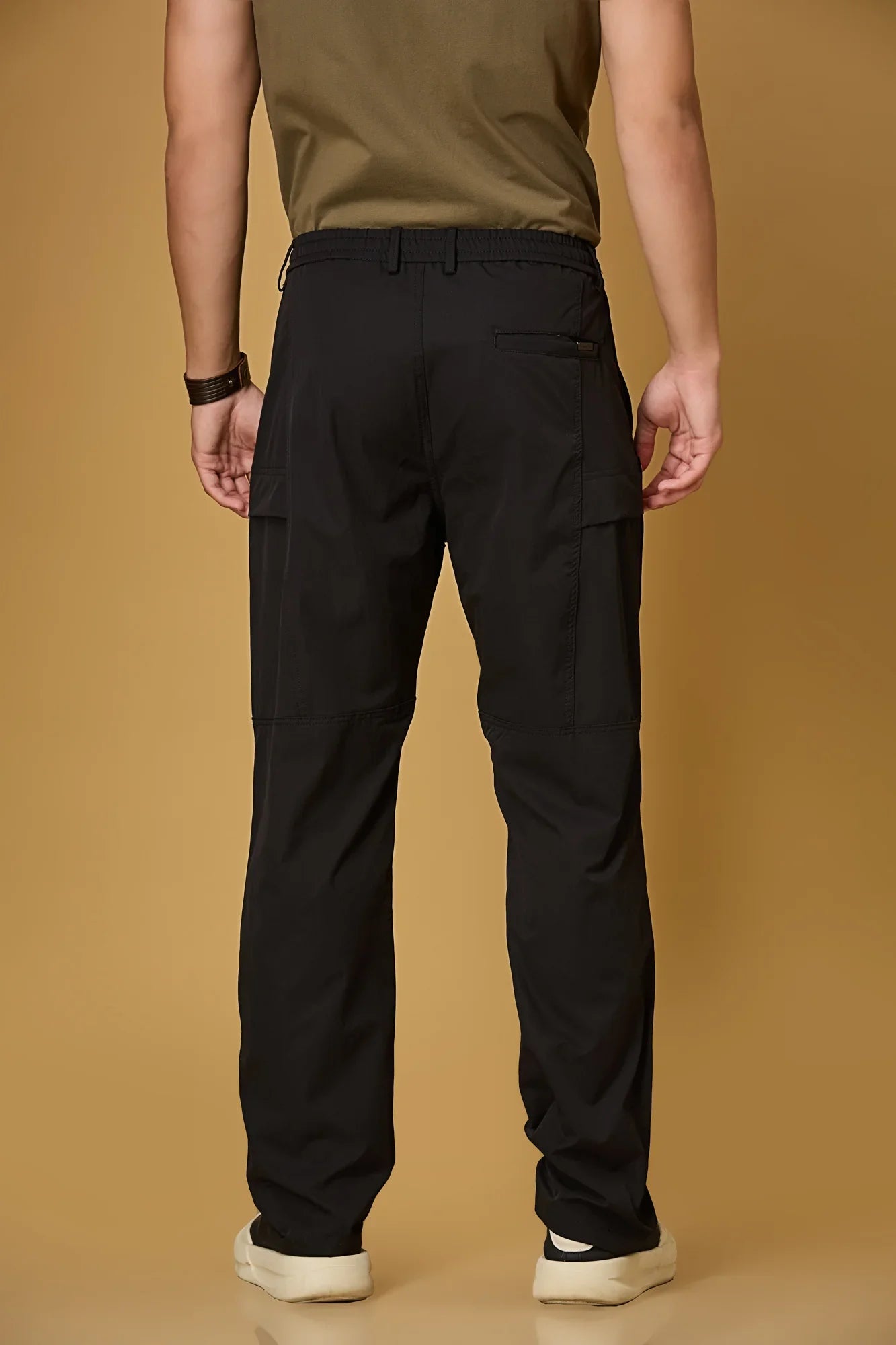 Men’s black casual pants back view – polyester stretch fabric comfort fit.