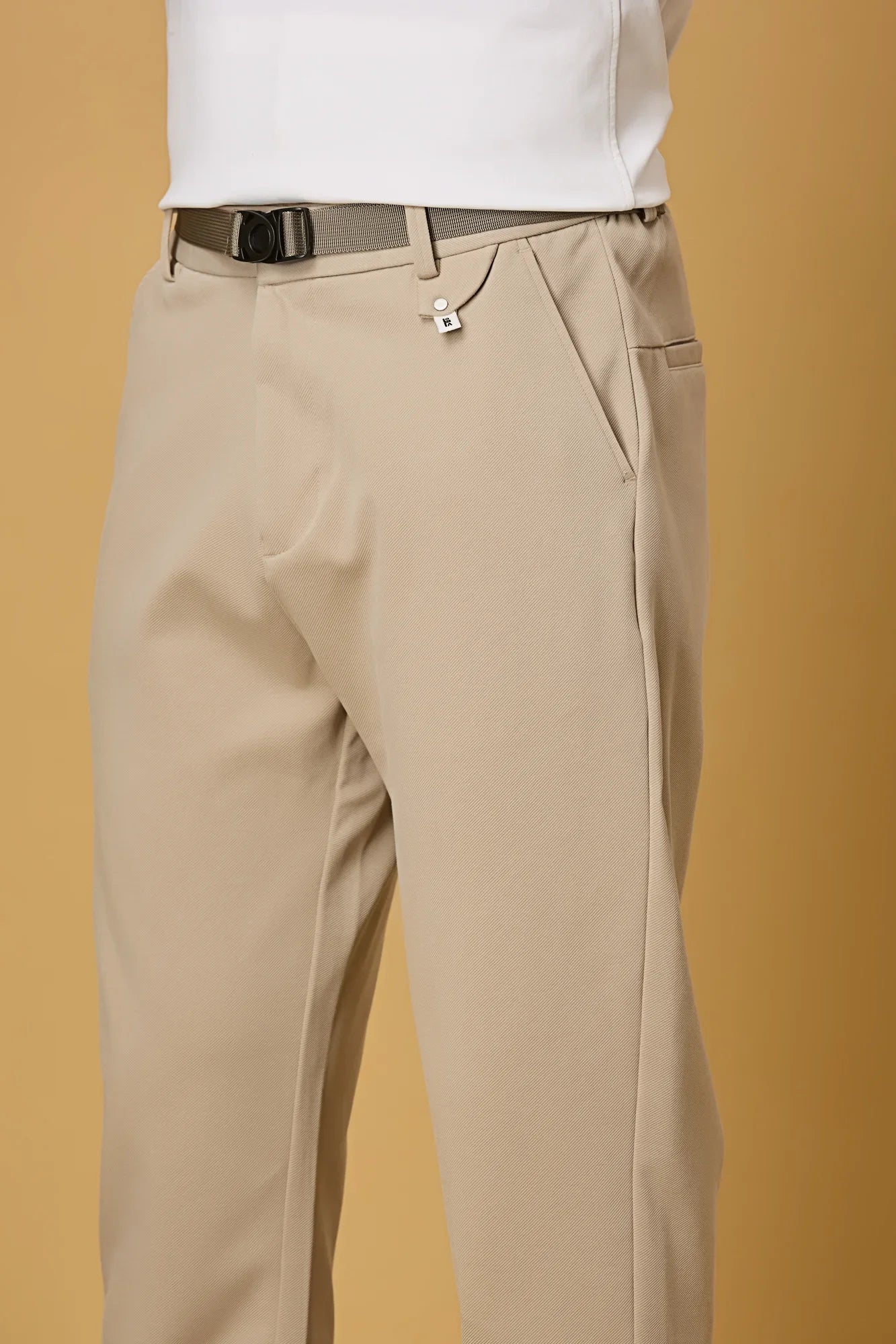 Close-up of Light Khaki Tencel cotton spandex fabric and belt detail – smooth stretch texture of LOFA men’s formal trousers.