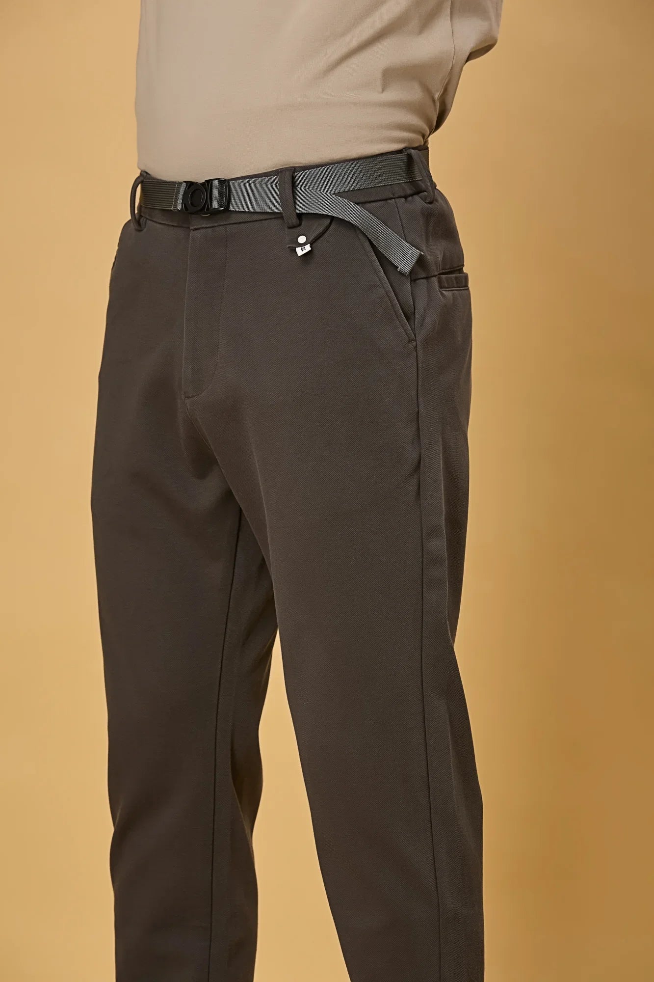 Close-up of grey Tencel cotton spandex fabric and belt detail – smooth stretch texture of LOFA men’s formal trousers.