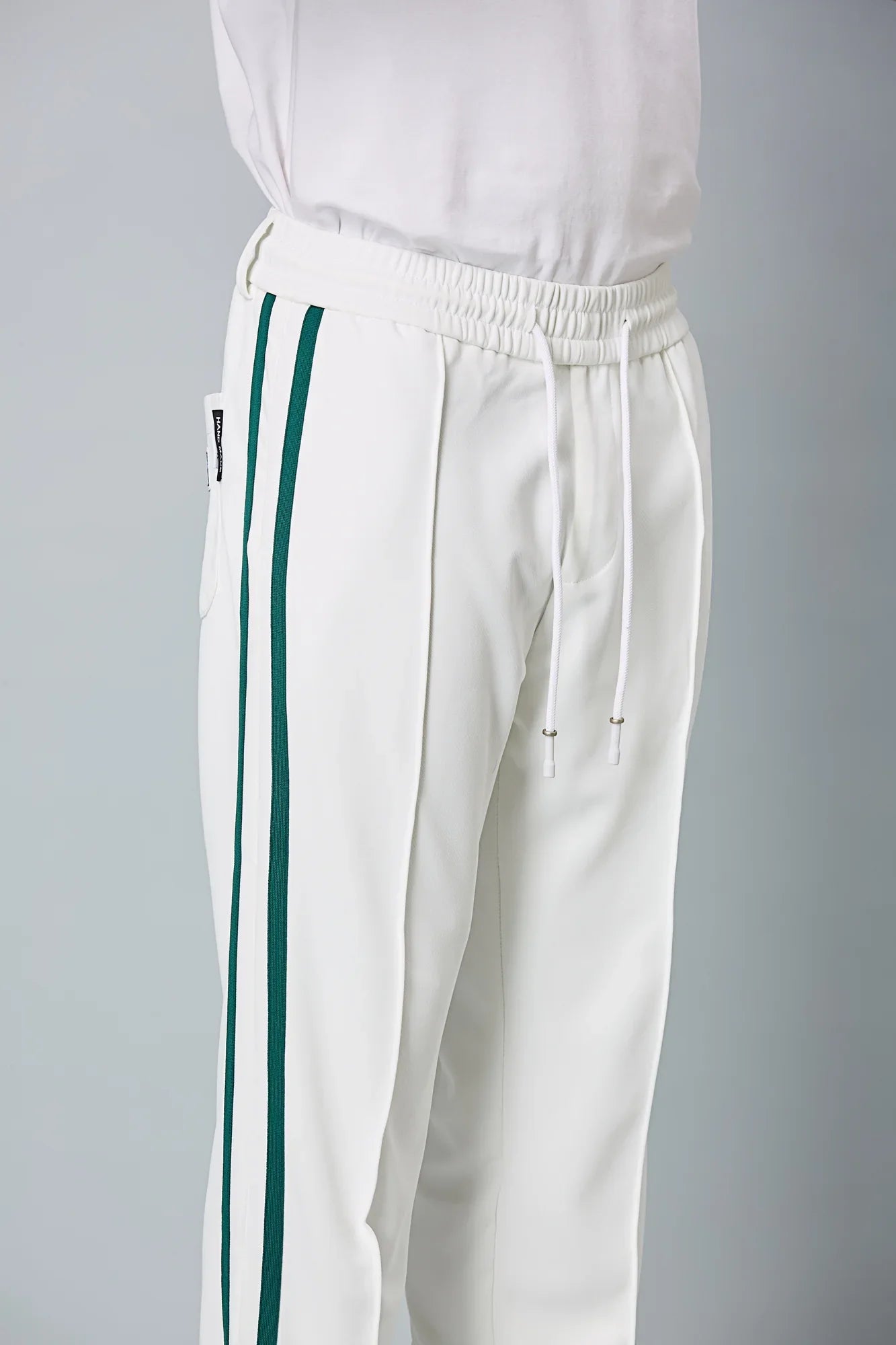 Close-up of polyester spandex blend fabric of LOFA men’s active pants – soft, smooth, and stretchable texture.