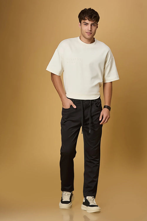 black stretchable trousers side view showing casual comfort fit.