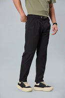 black stretchable trousers side view showing comfort fit and pleated front.