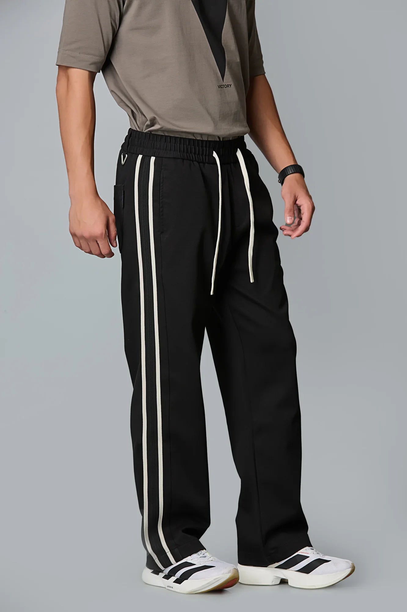 Side View of LOFA Men’s Black Baggy Fit Active Pants with Waist Strings